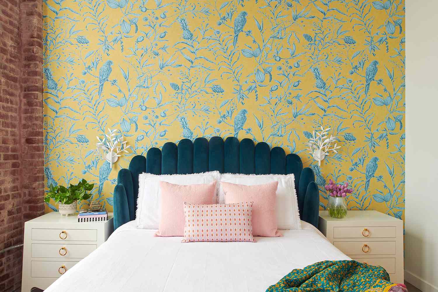 Colorful patterned wallpaper feature wall in a bedroom